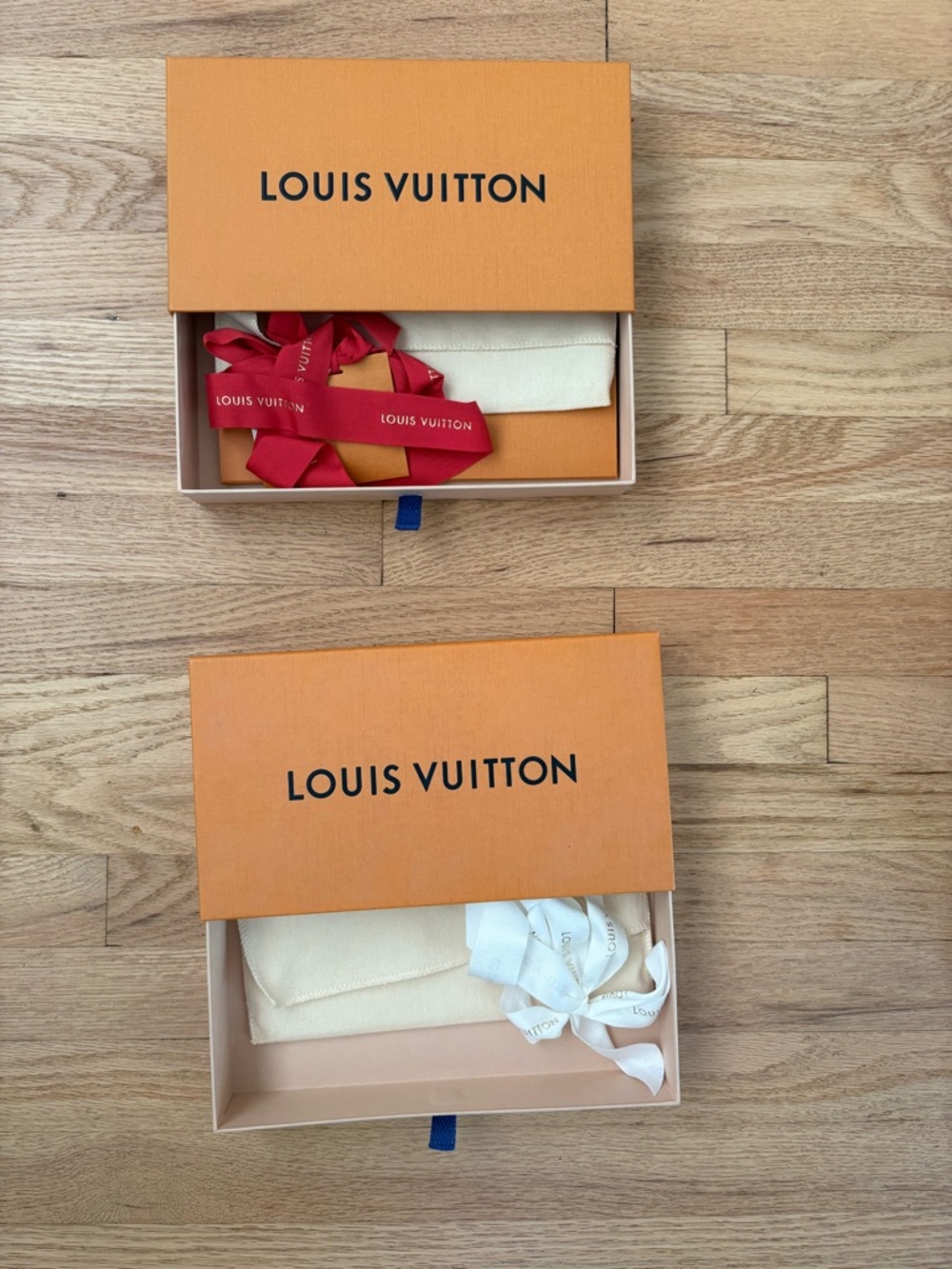 Louis Vuitton Orange Boxes with Red and White Ribbons